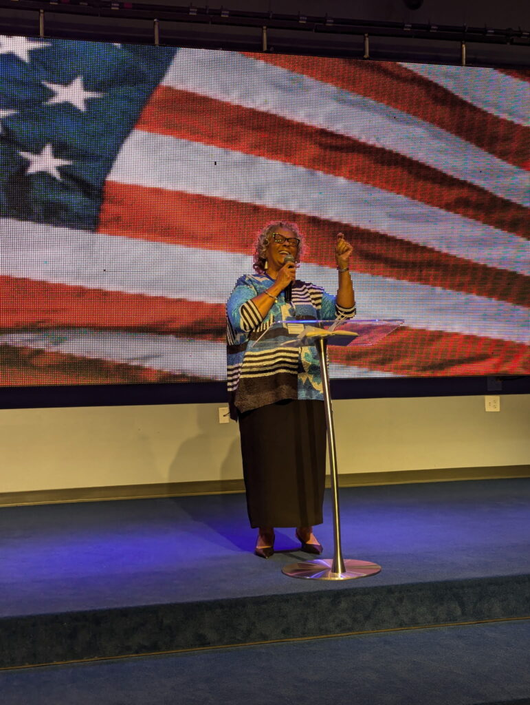 On stage with american flag